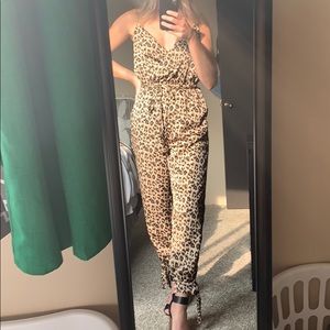 Adorable leopard jumpsuit in small. Never worn!